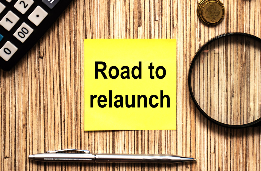 Text Road to relaunch in yellow notes with pen